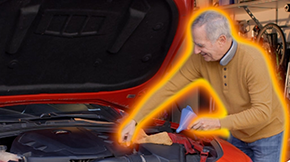 Senior man working on a car